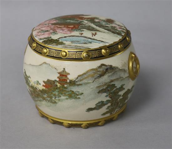 A Japanese Satsuma pottery drum shaped box and cover, Meiji period